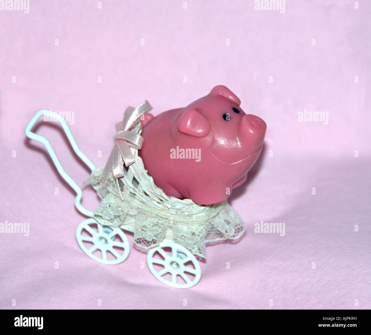 Toy pig in miniature pram Stock Photo Alamy