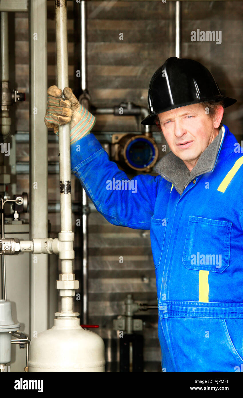 Industrial worker with oilfield equipment Stock Photo Alamy