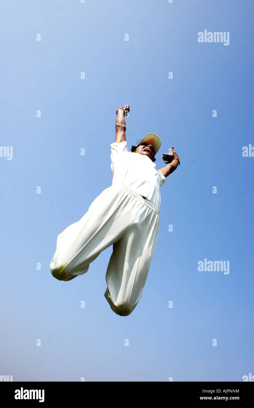 Cricket player jumping in joy Stock Photo Alamy