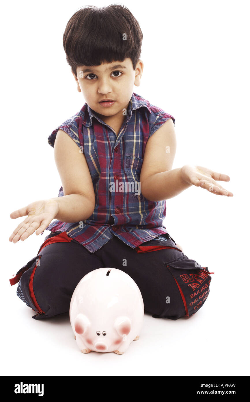 Portrait of a boy and a piggy bank Stock Photo - Alamy