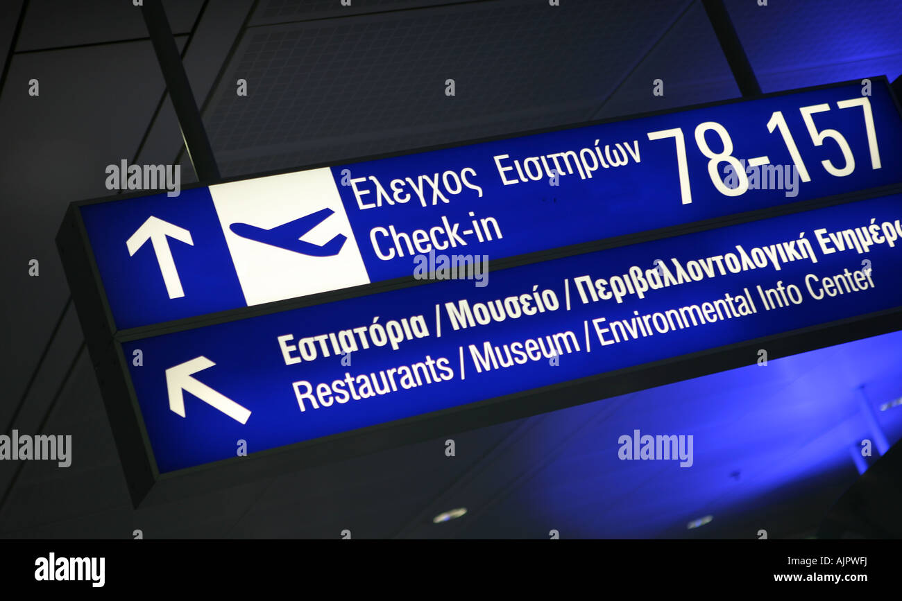 Check in and information signs in English and Greek at Eleftherios Venizelos International Airport Athens Stock Photo