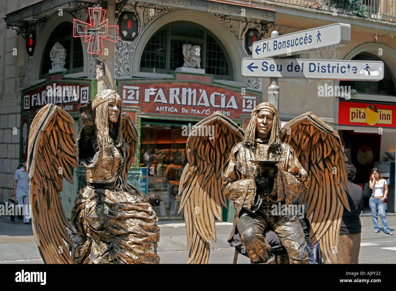 spain Barcelona ramblas street artists angel costums Stock Photo