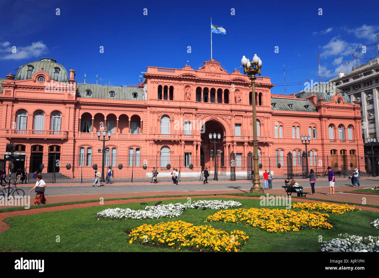 “Pink House” (National Government presidential Palace) with people and flowers. Plaza de Mayo, Buenos Aires, Argentina Stock Photo