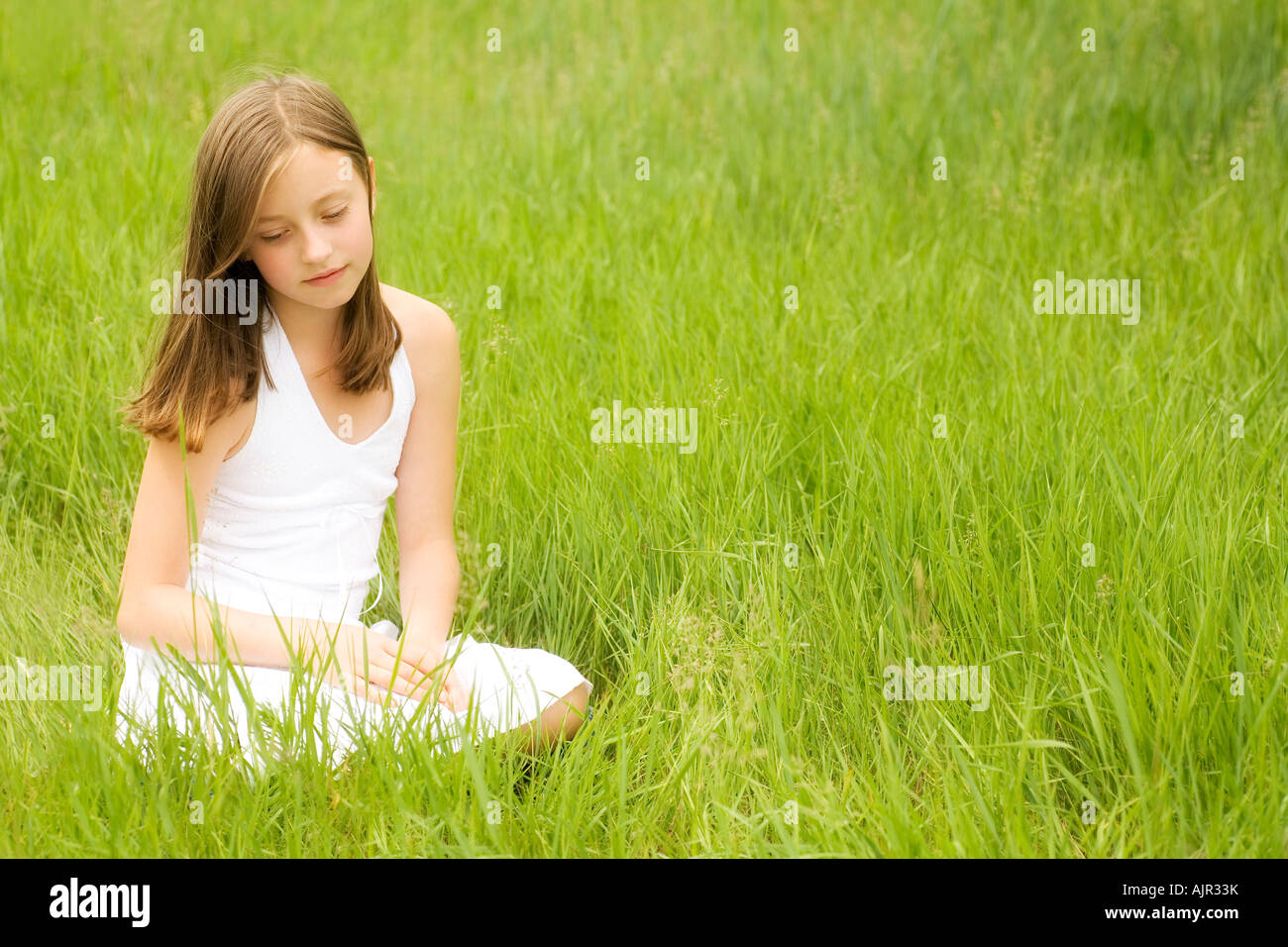 Girl sitting in the park Stock Photo - Alamy