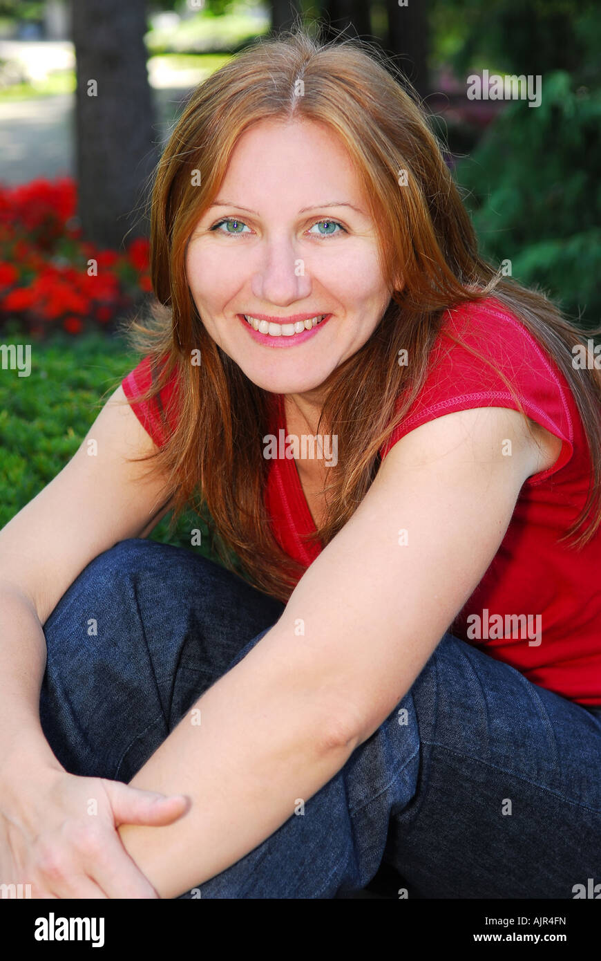 Portrait of a smiling mature woman outside Stock Photo - Alamy
