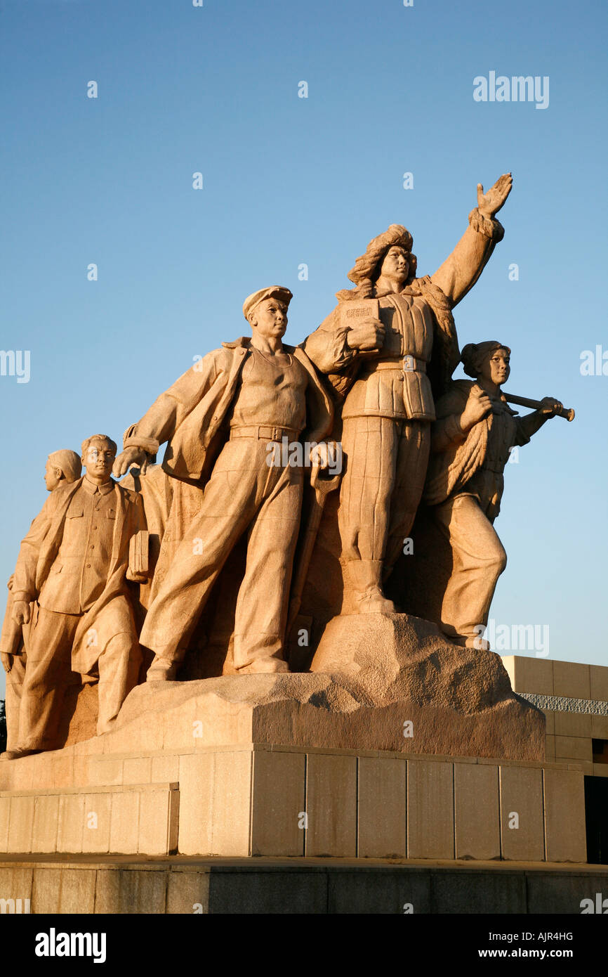 Statue of workers peasants and soldiers in front of Mao Zedong Memorial Hall Tiananmen square Beijing China Stock Photo