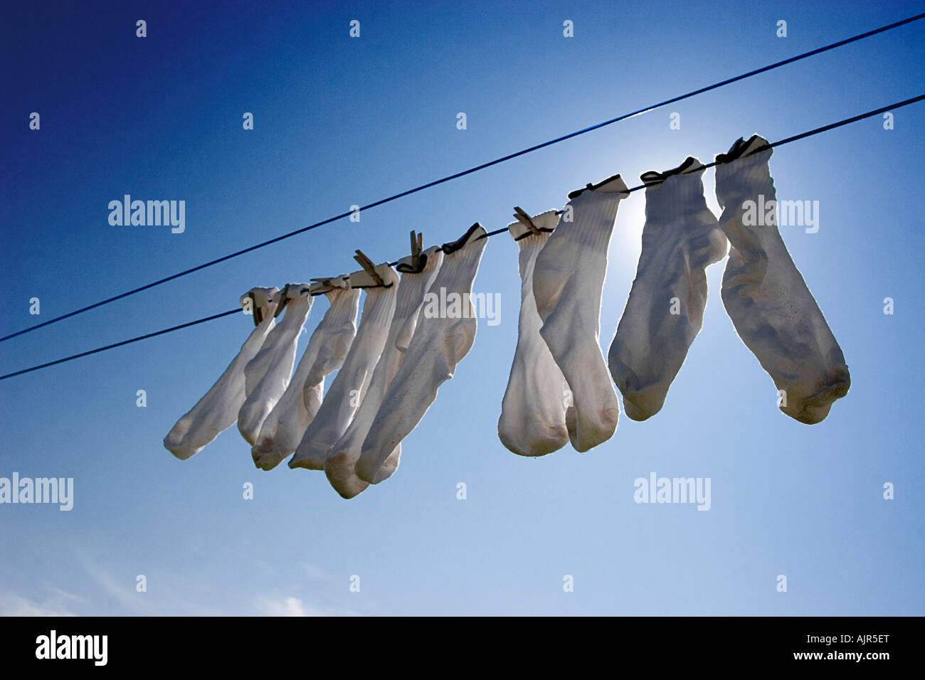 Socks hanging from a clothes line Stock Photo - Alamy