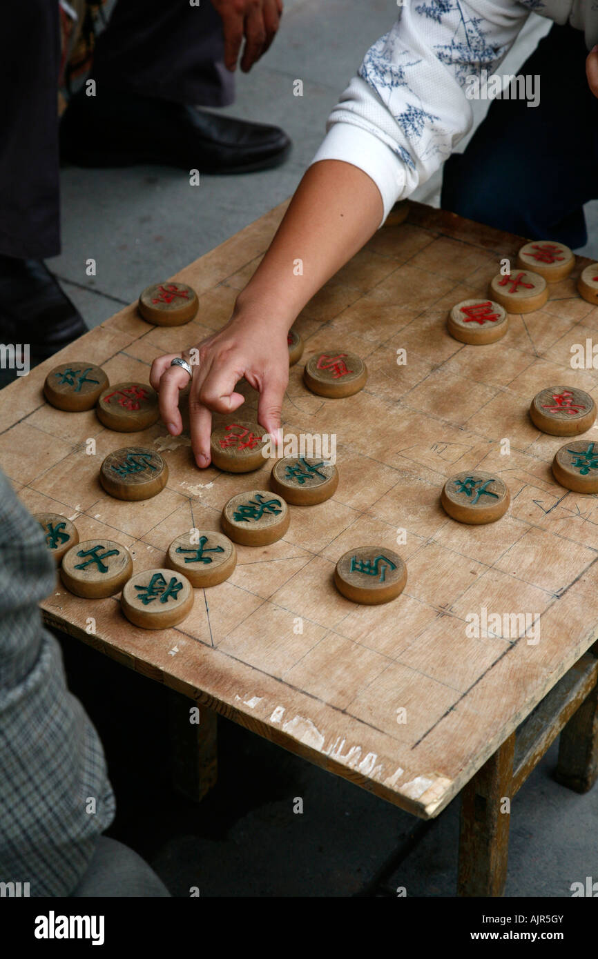 Two men playing Chinese Chess in the street Beijing China Stock Photo