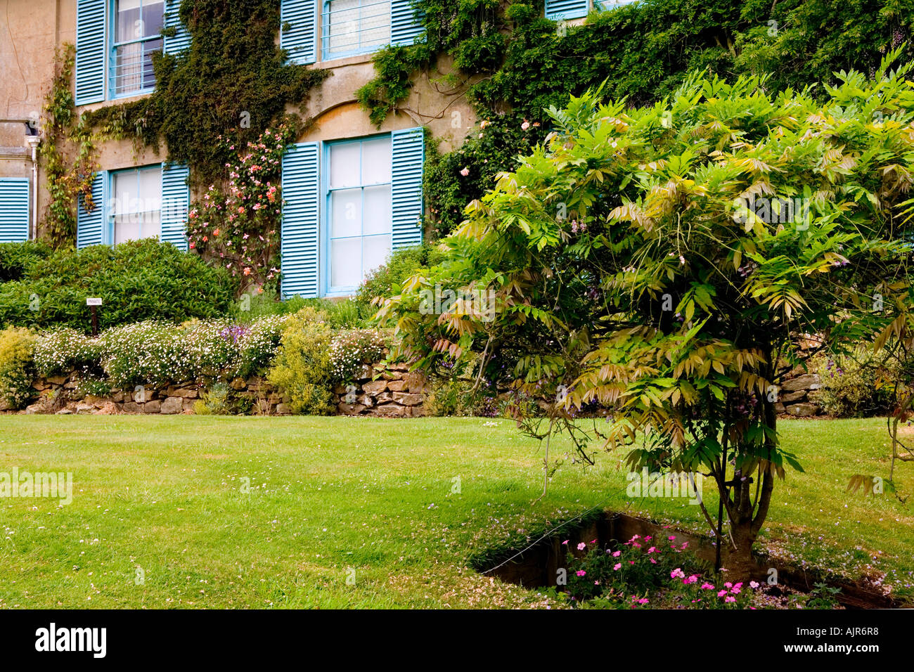 Broadleas Garden, Devizes, Wiltshire with blue shutters of the House in