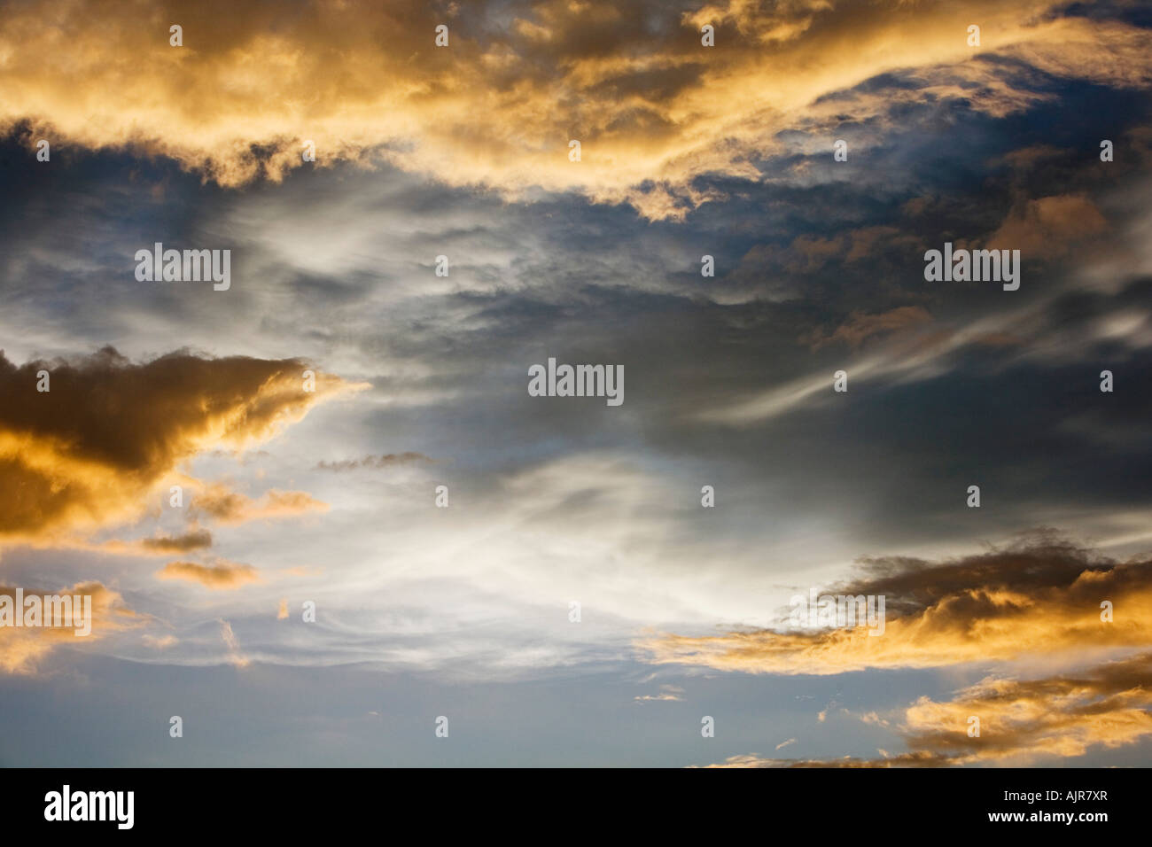 Sunset storm clouds in India. Indian cloudy sky in the evening sunlight Stock Photo