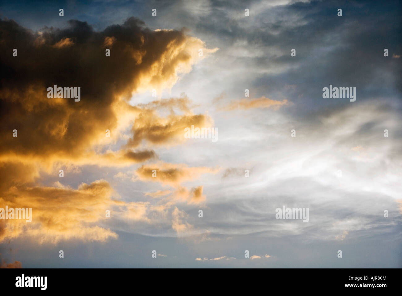 Sunset storm clouds in India. Indian cloudy sky in the evening sunlight Stock Photo