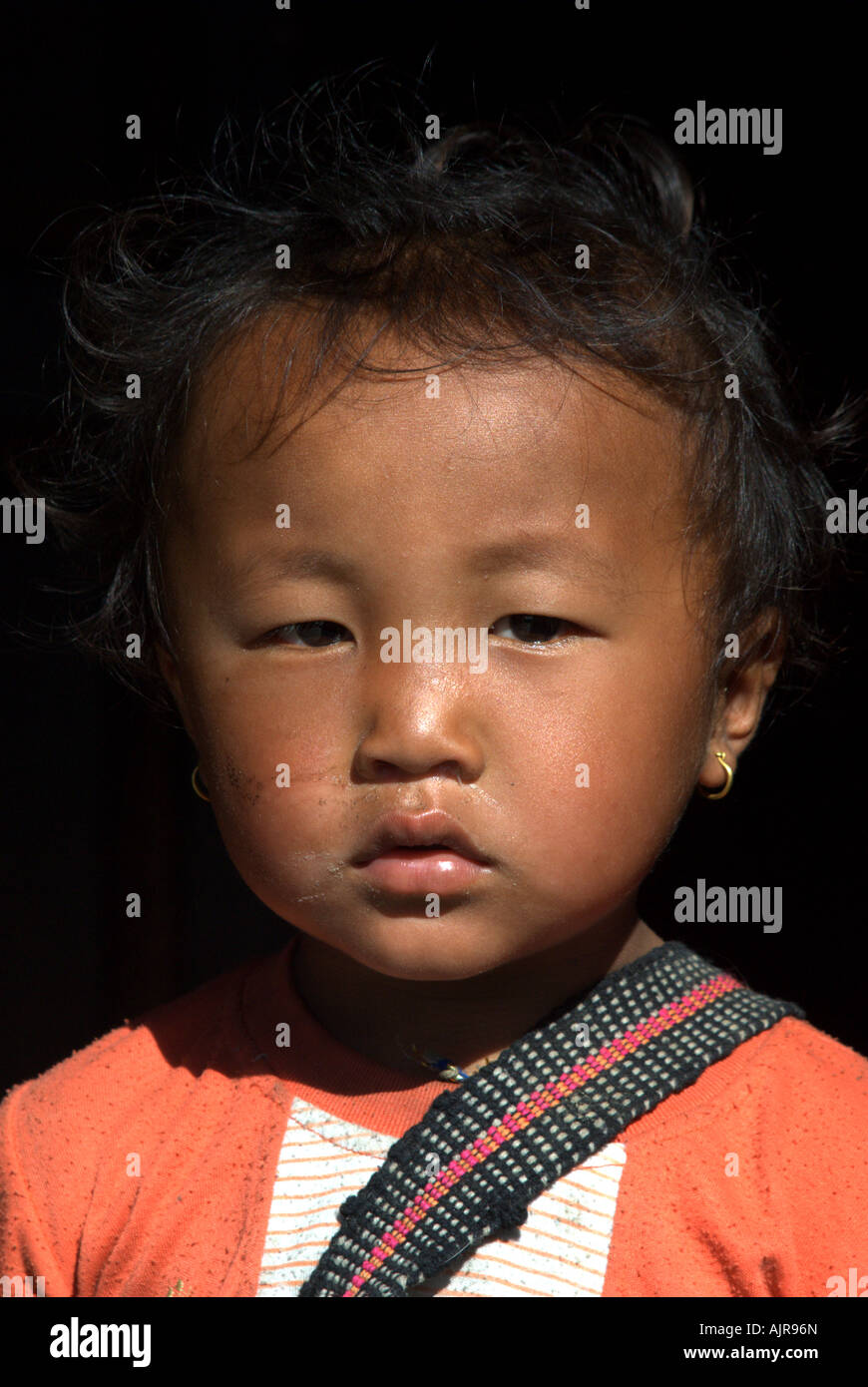 A three-year-old Gurung boy poses for the camera, Annapurna Basecamp trek, Annapurna Sanctuary, Nepal Stock Photo