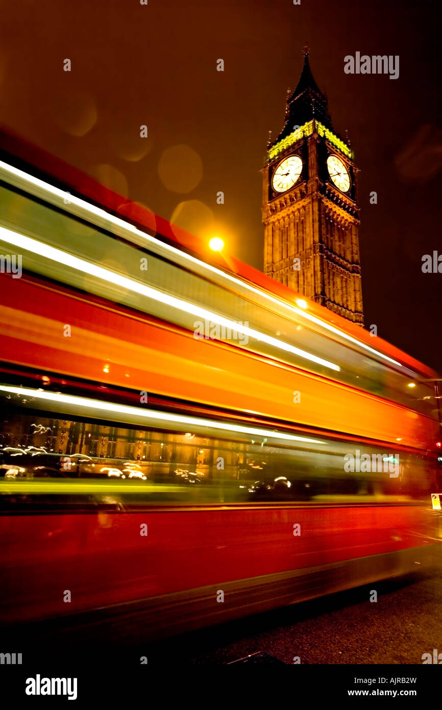 Big Ben Clock and the Houses of Parliament with Iconic London Red Bus at Rush Hour Stock Photo