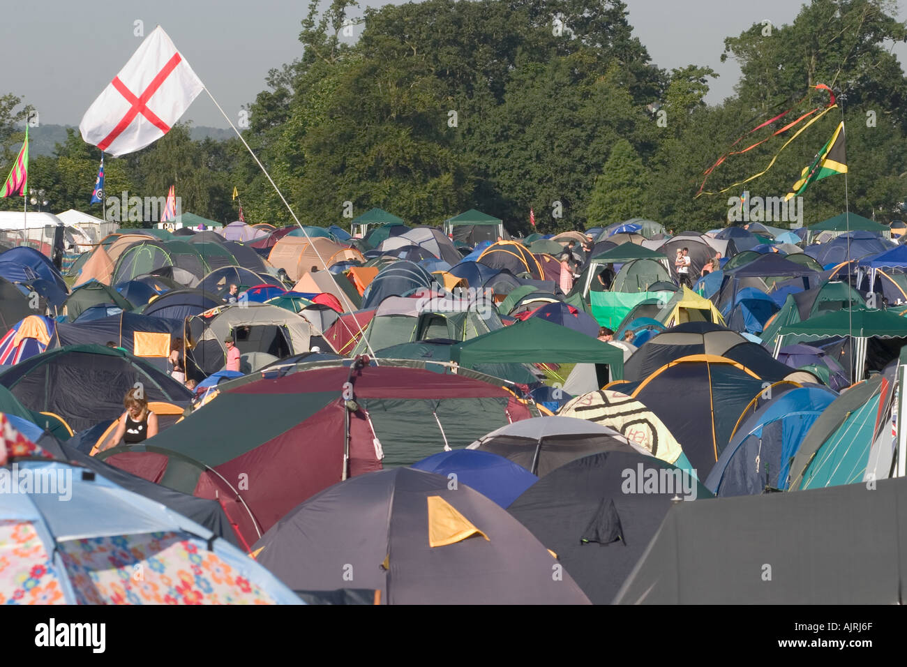 England flag in mass of tents at crowded camp site. Guilfest rock music Festival, Guildford, England Stock Photo