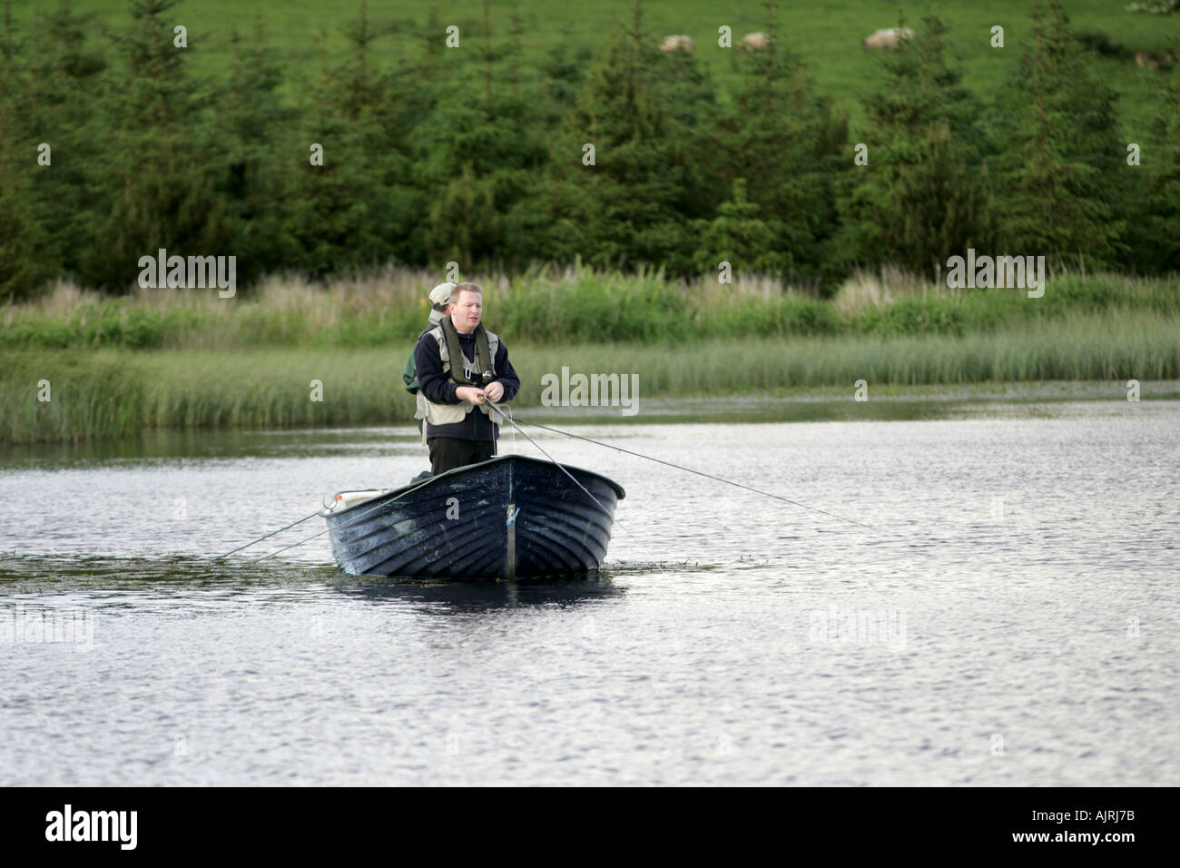 Fly fishing for lake trout from a boat Tildarg fishery county antrim