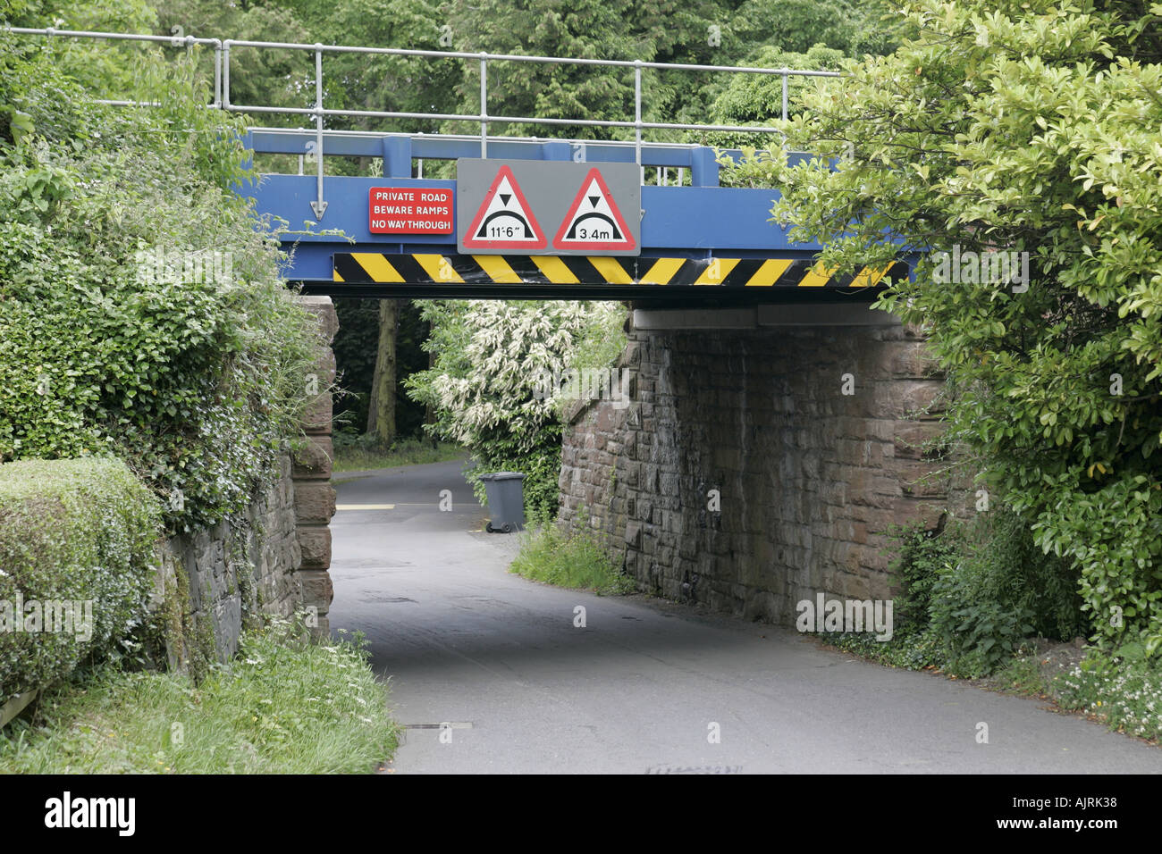 Low railway bridge over country lane Cultra county down Northern Ireland Stock Photo