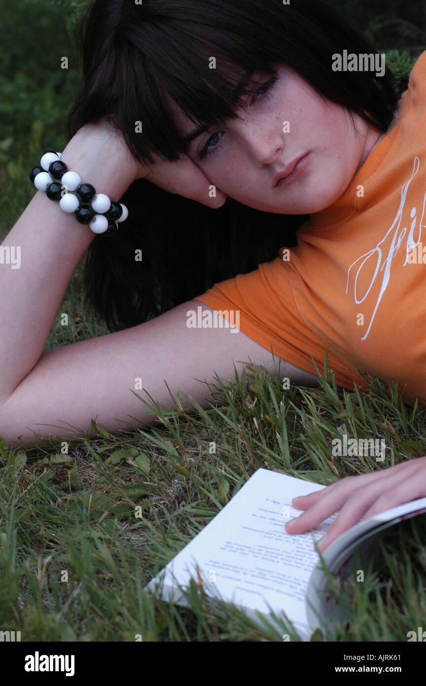 Young woman reading a book Stock Photo