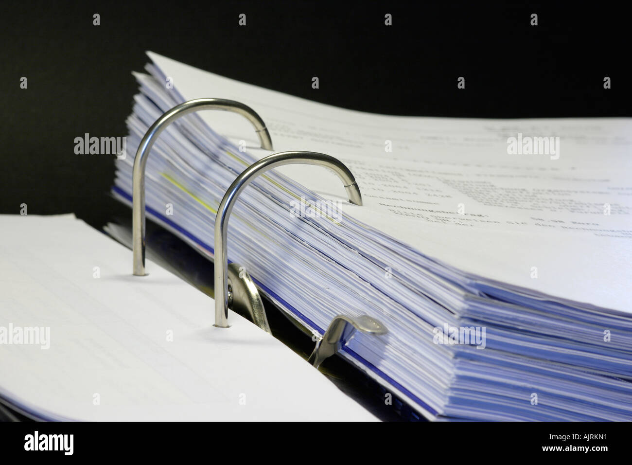 Open binder with different documents on black background Stock Photo