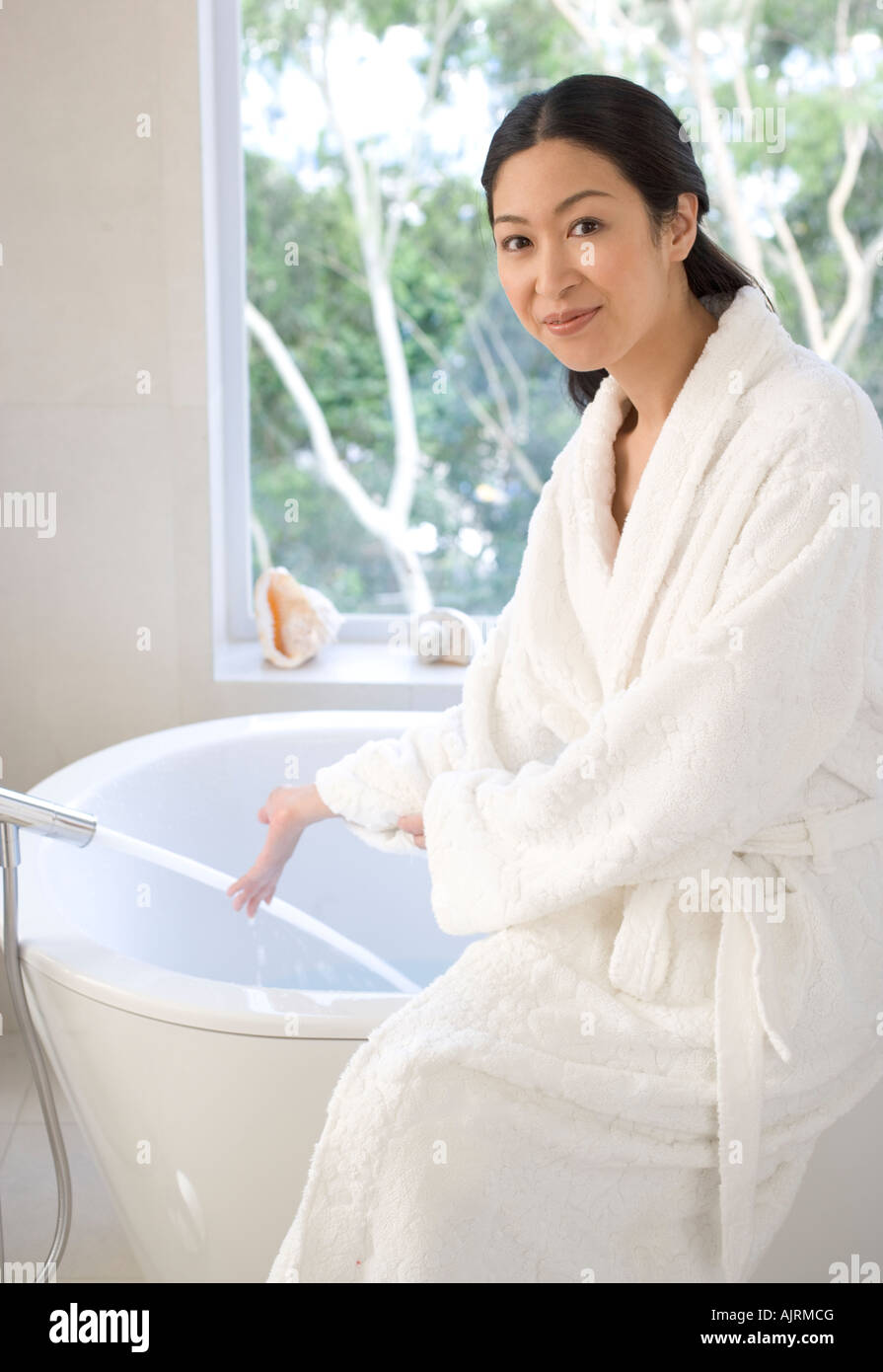 Bathub Robe Woman in bath robe running a bath hi-res stock photography and images ...