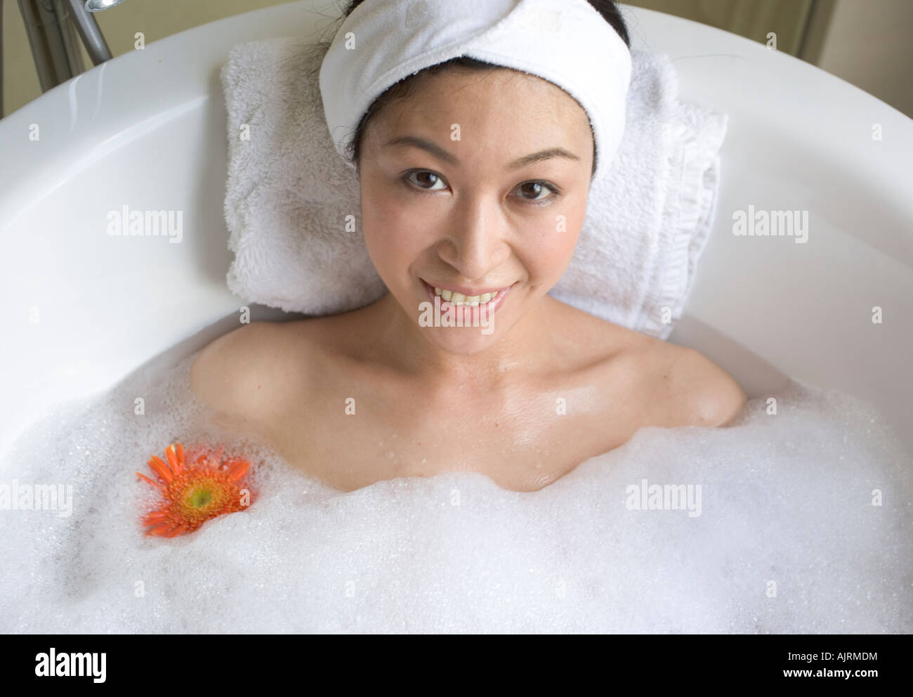 Young woman taking a bath Stock Photo Alamy
