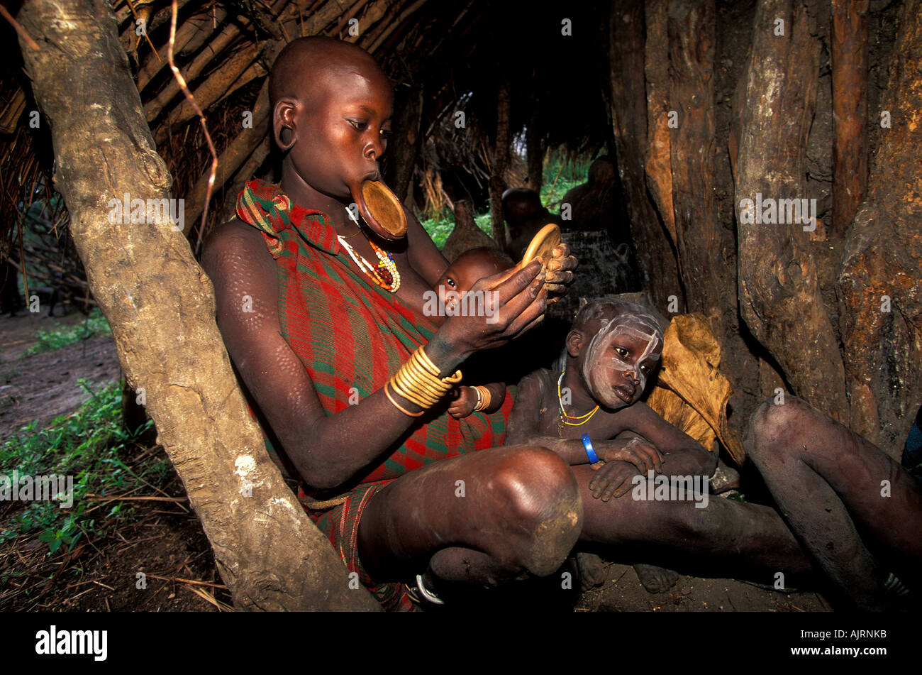 Surma woman with lip plate , west of Omo River Ethiopia . Stock Photo