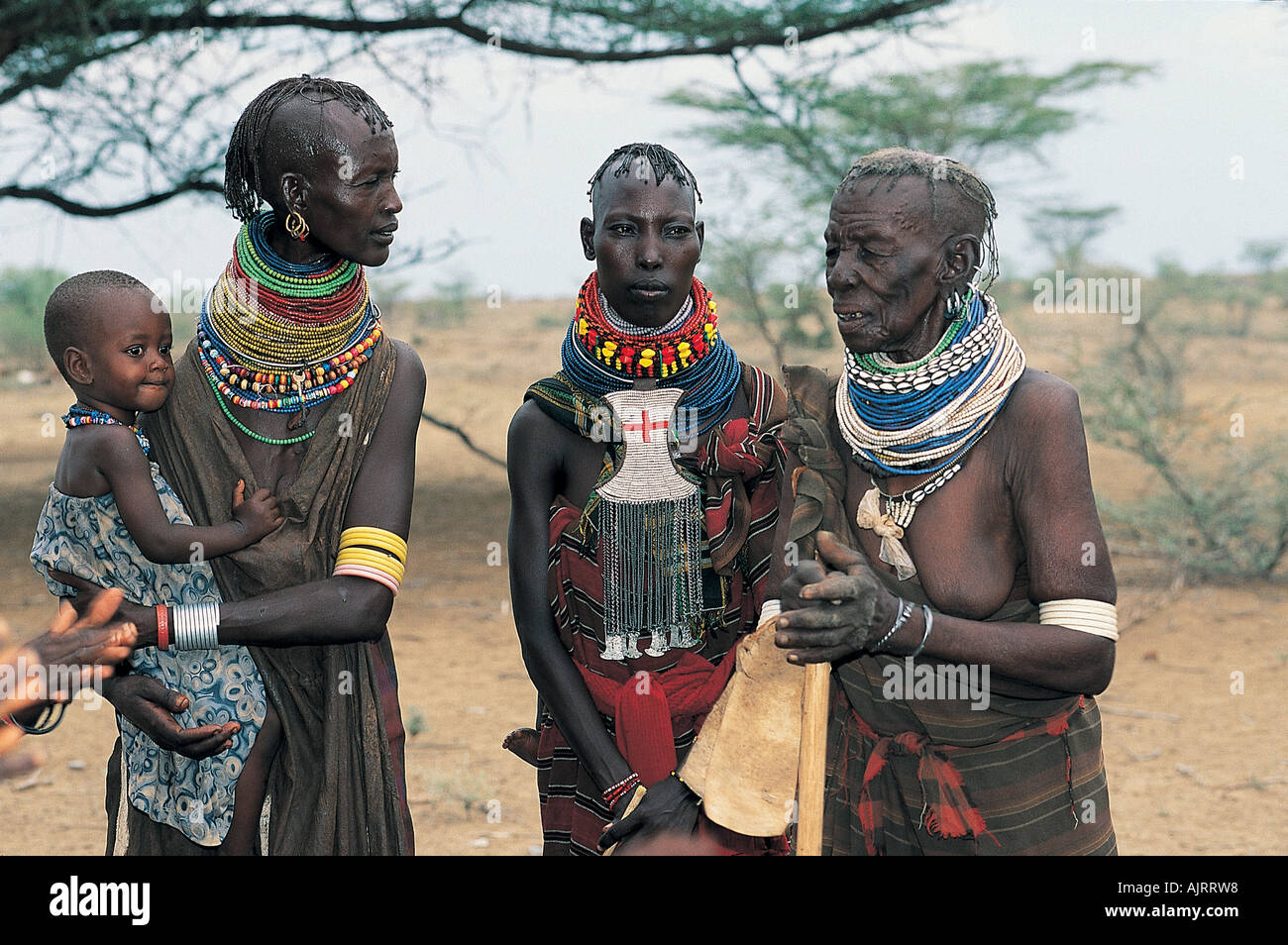 Elder Turkana woman with her daughters, Kenya. Stock Photo