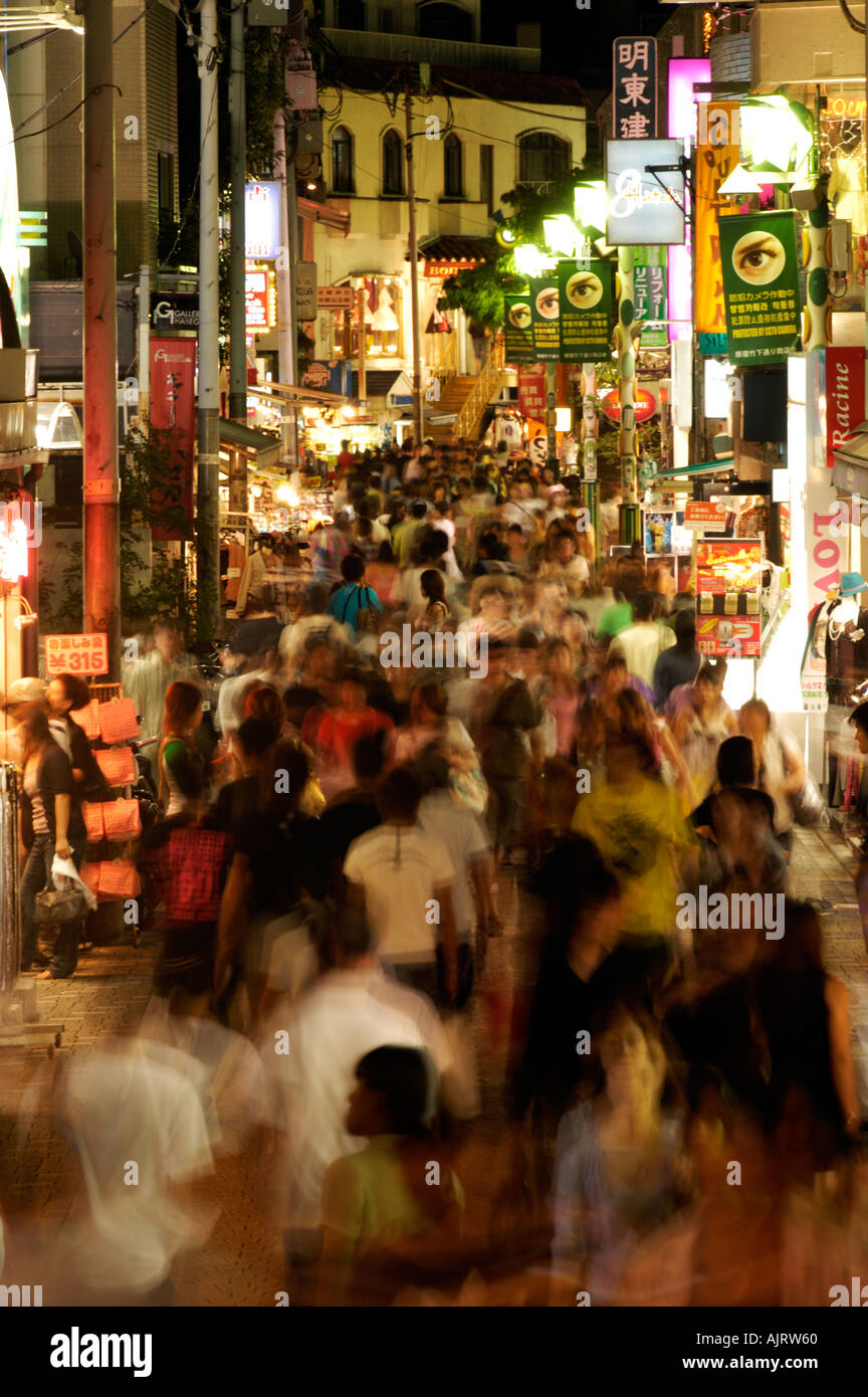 Long exposure to blur movement of crowds of people in trendy Takeshita Street Harajuku Tokyo Japan Stock Photo