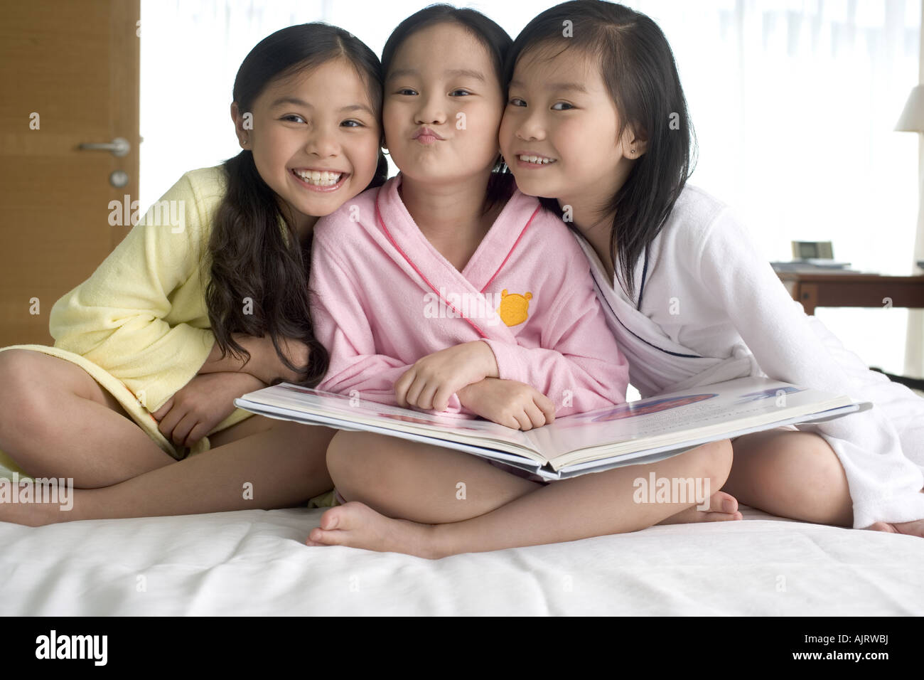 Close-up of three girls smiling Stock Photo - Alamy