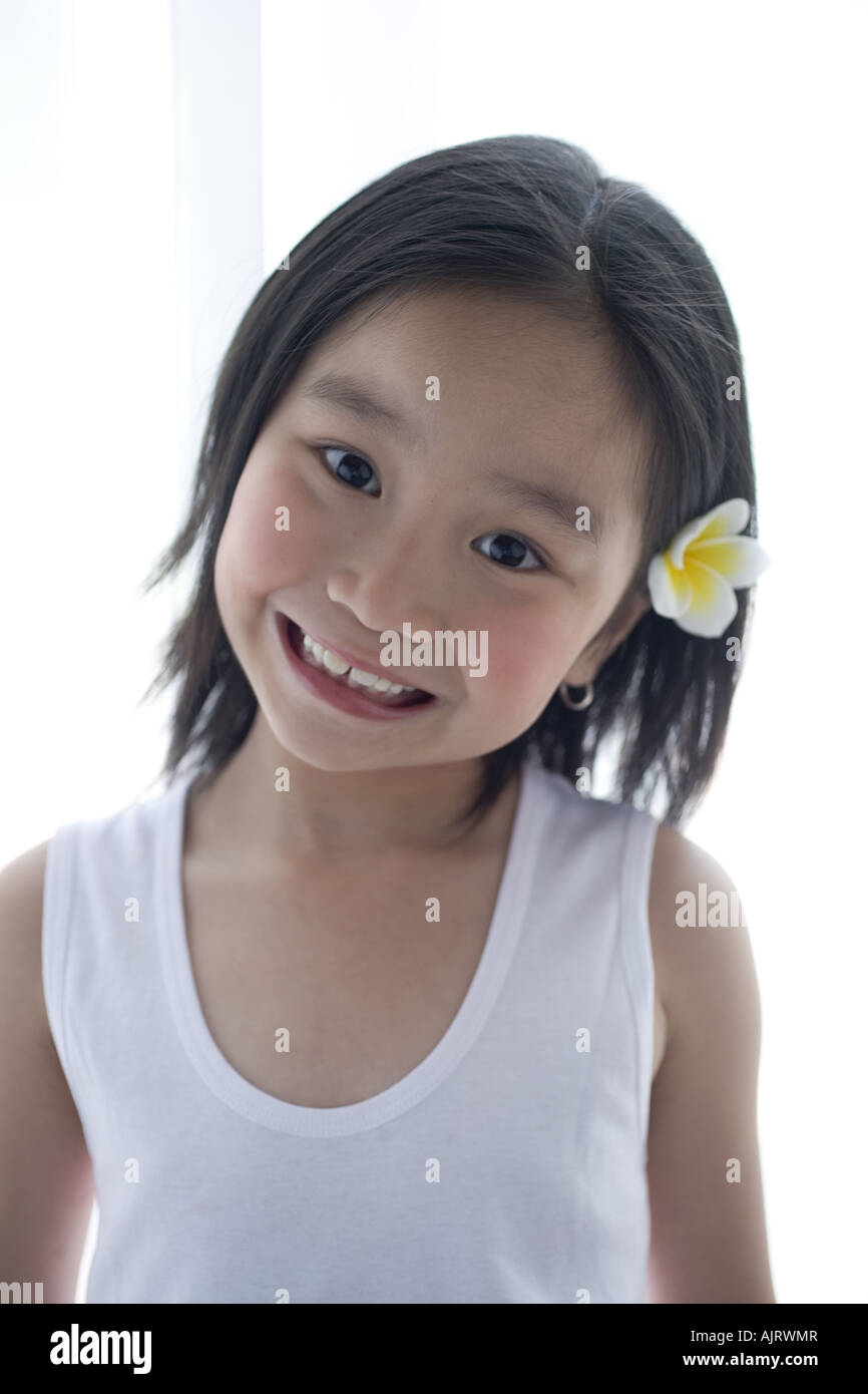 Portrait of a girl with flower in her hair Stock Photo - Alamy
