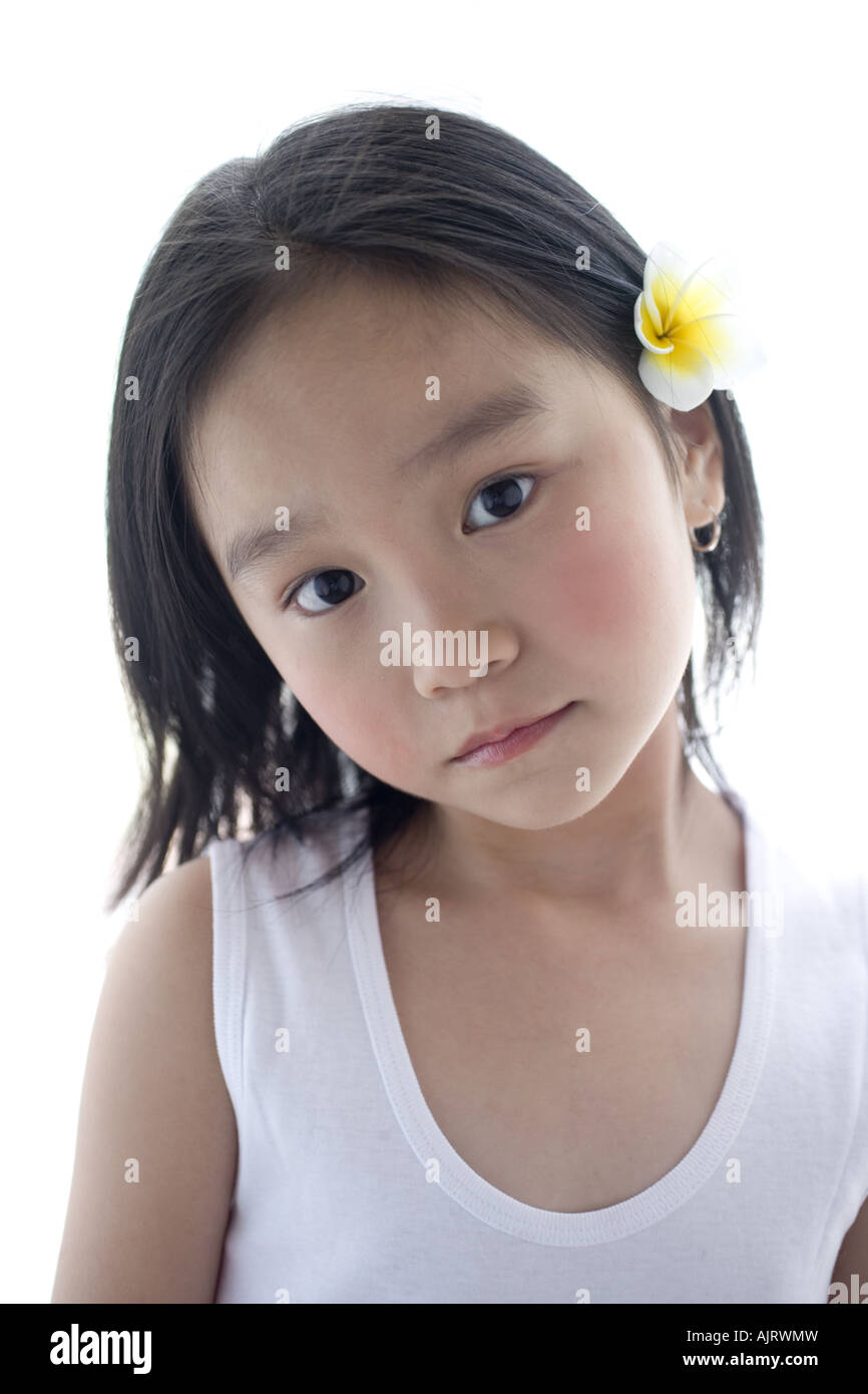 Portrait of a girl with flower in her hair Stock Photo - Alamy