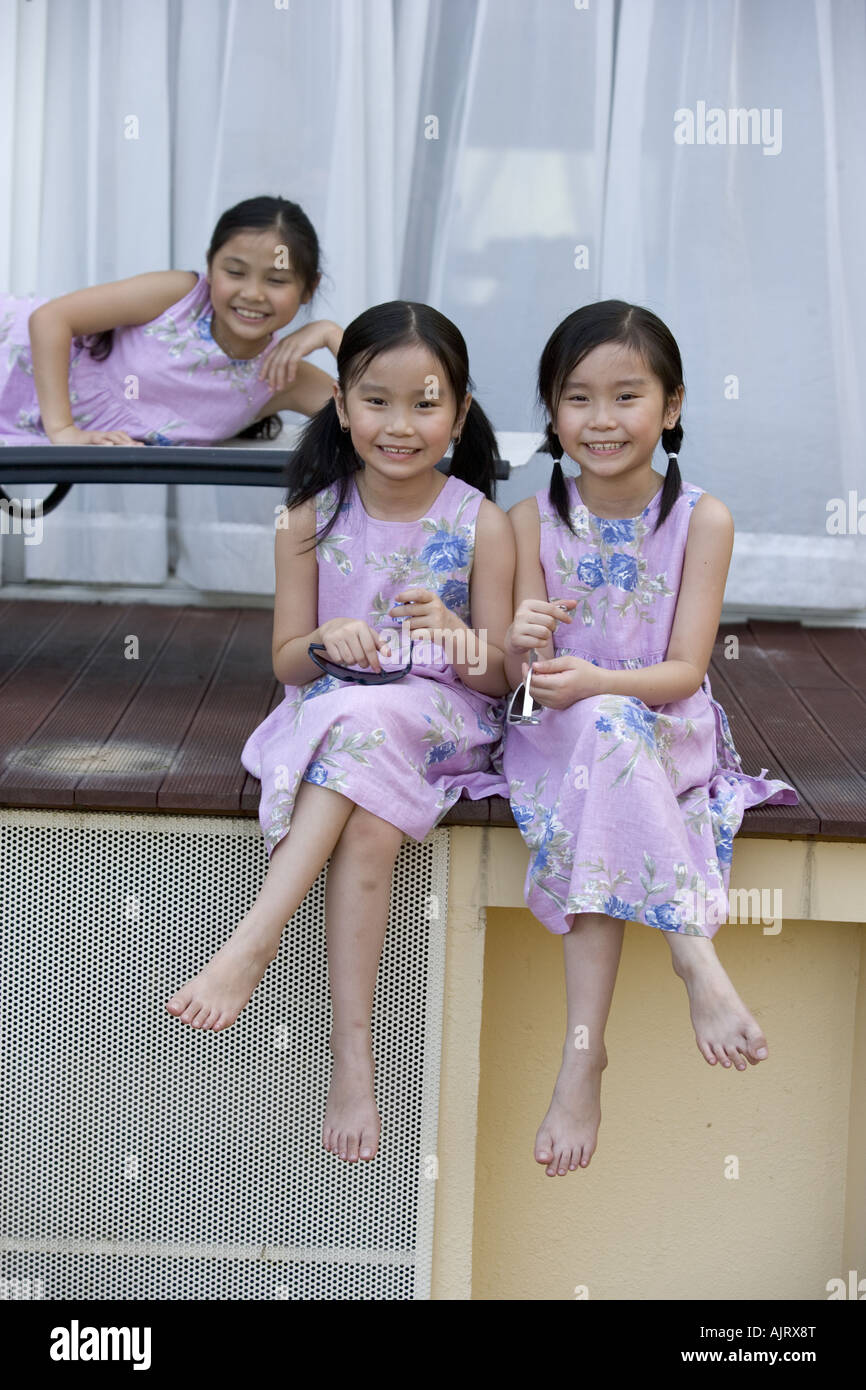 Portrait of three girls smiling Stock Photo - Alamy