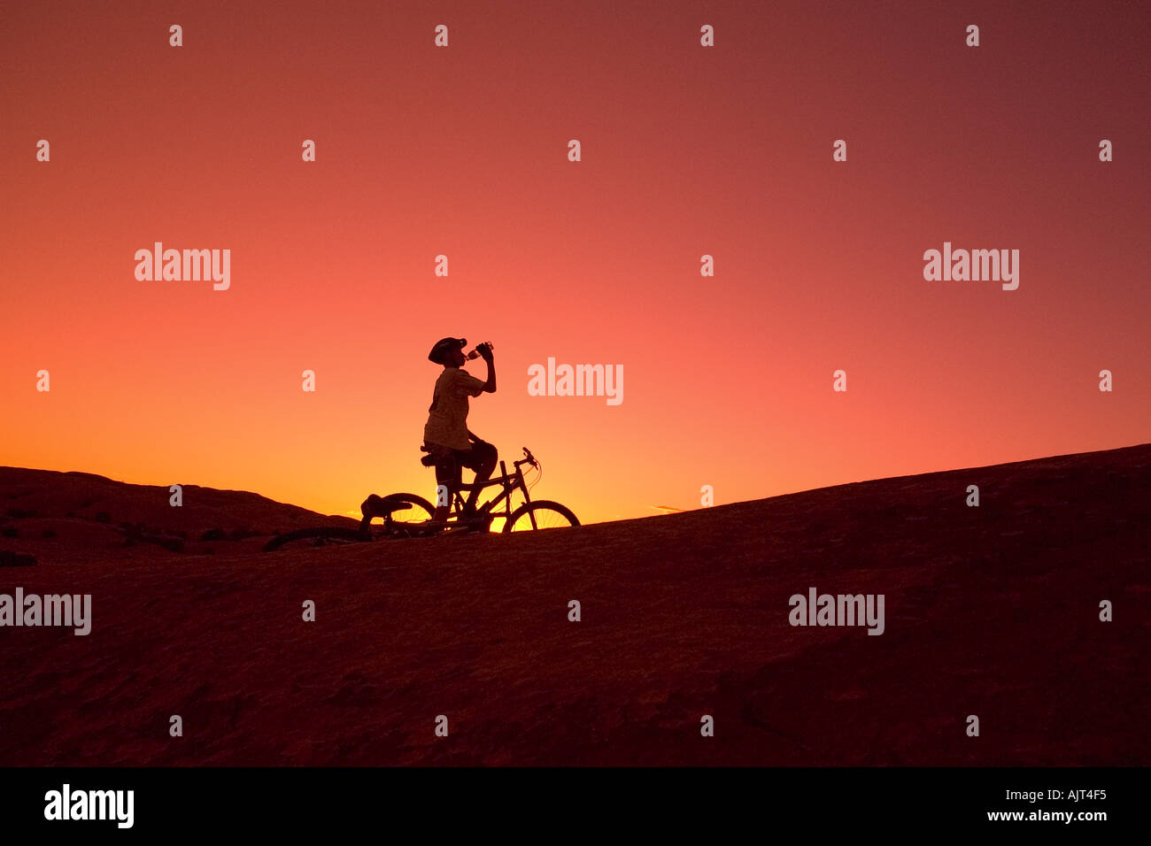 Silhouette person on bike Stock Photo - Alamy