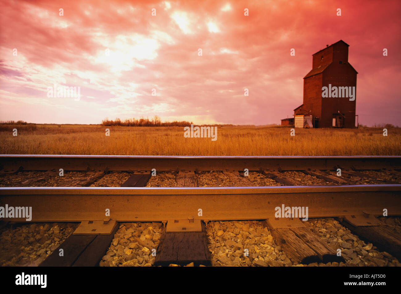 Railroad track and grain elevator Stock Photo