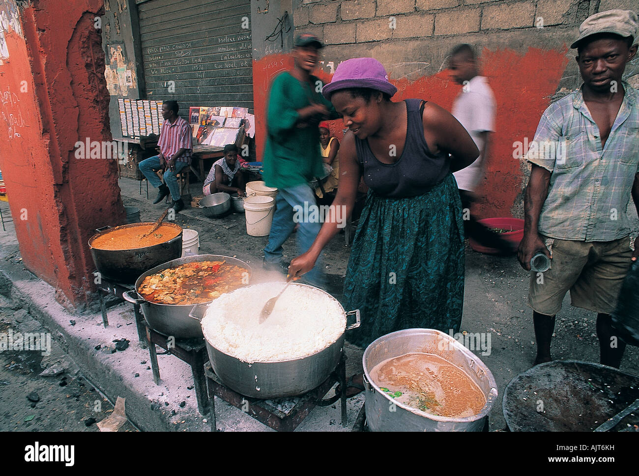 Haitian cooking food for a ceremony at street Stock Photo - Alamy