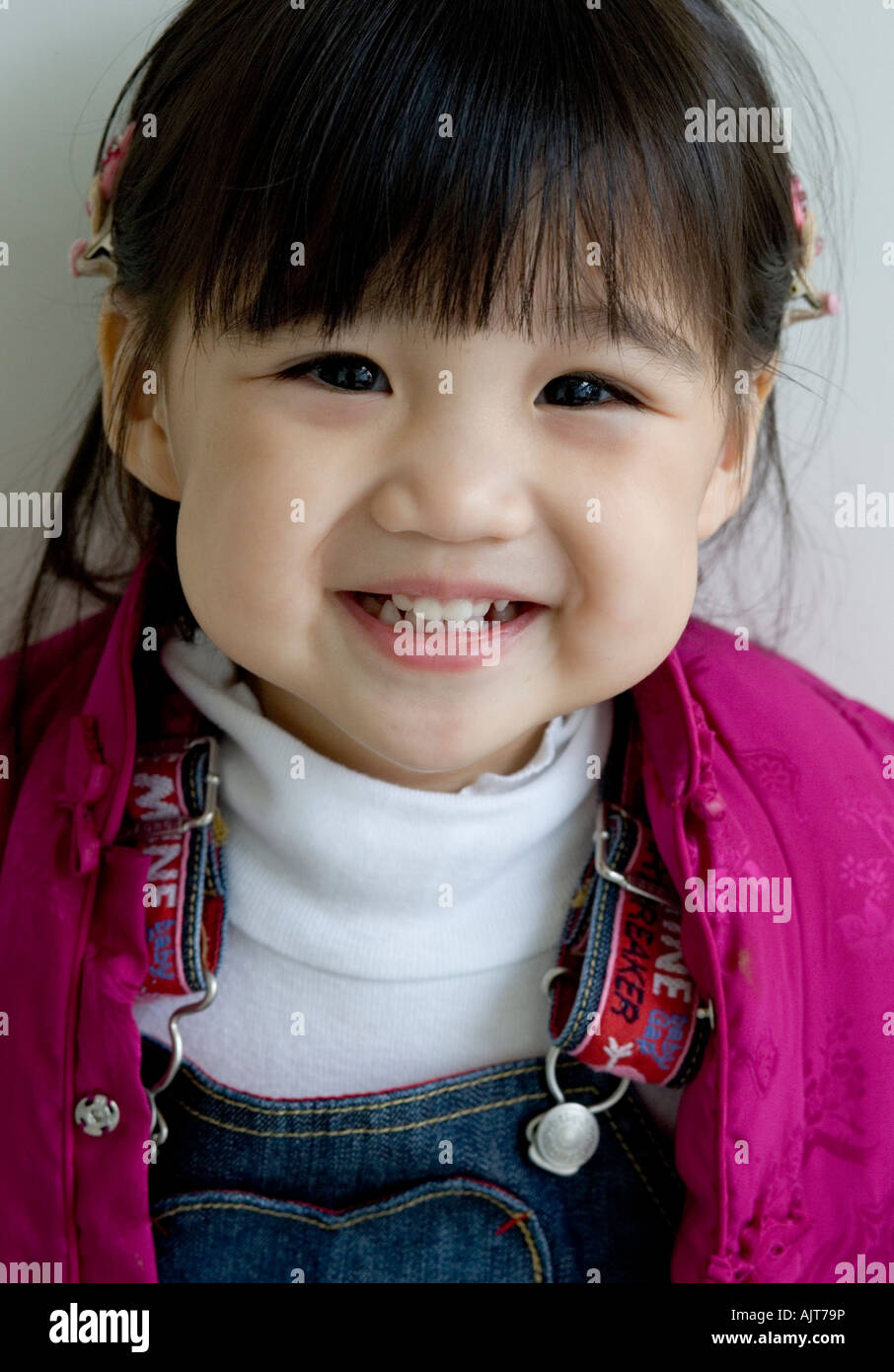 Portrait of a girl looking at camera Stock Photo - Alamy