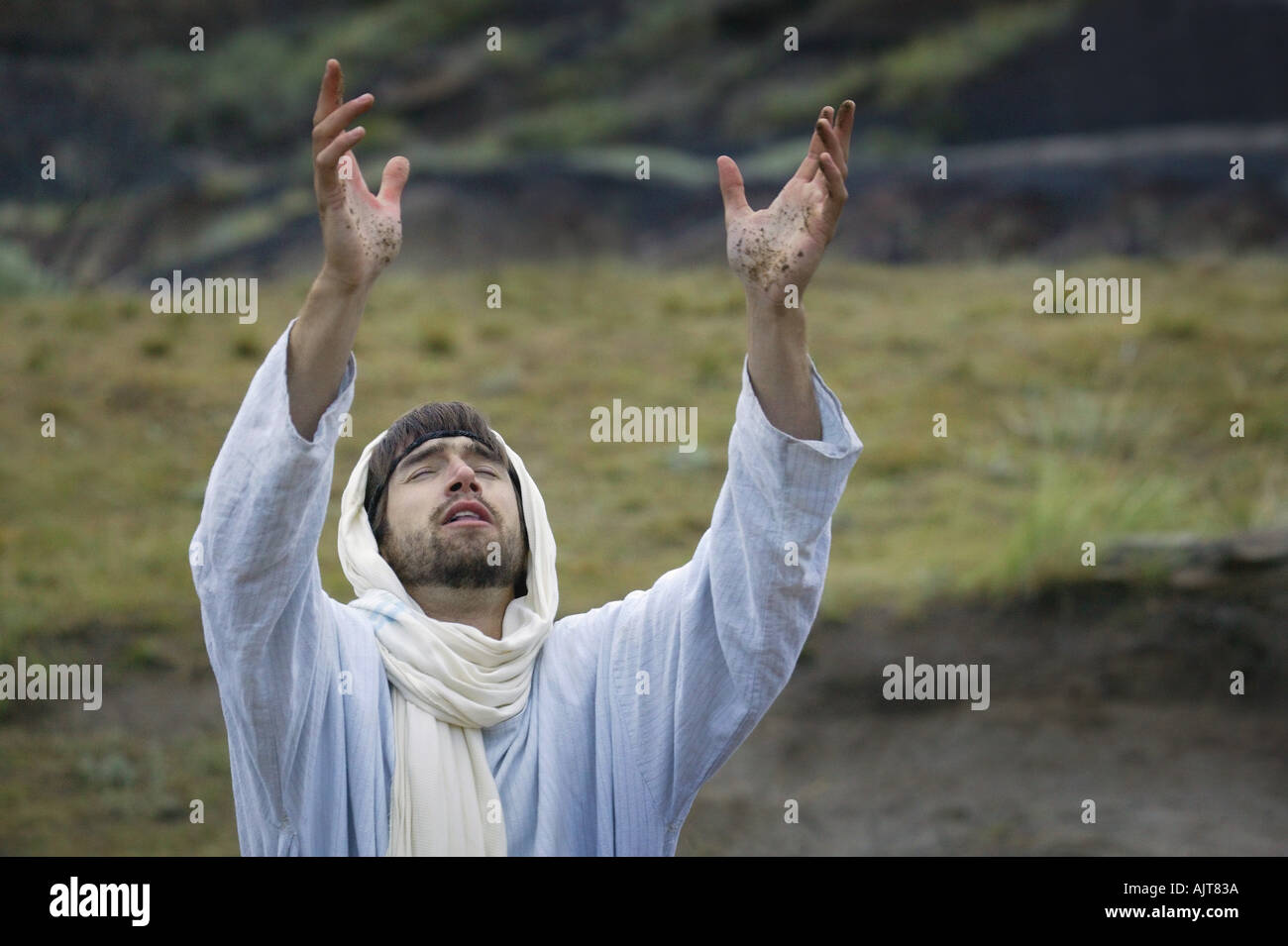 Jesus lifts his hands towards the heavens Stock Photo - Alamy