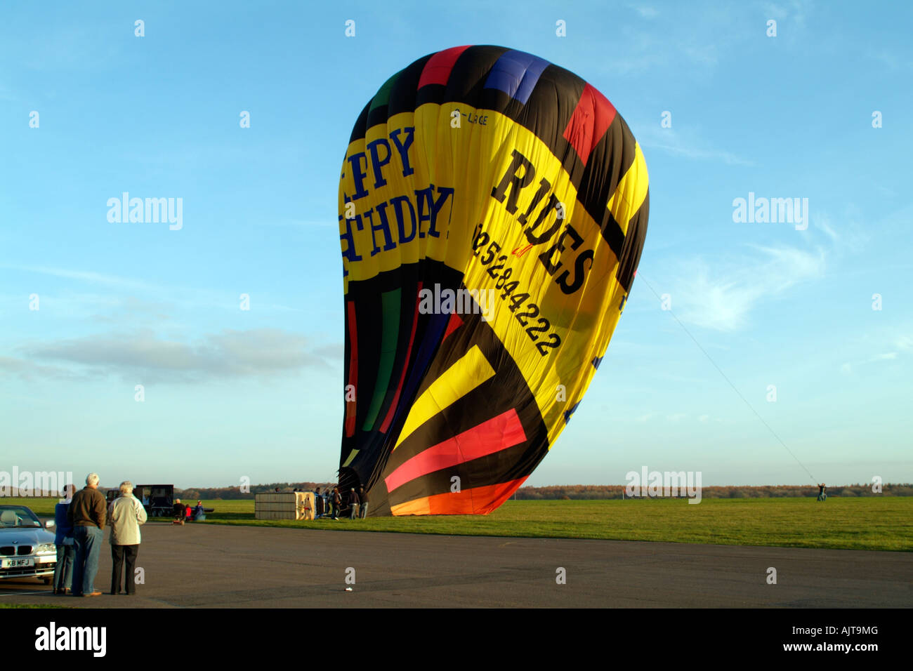 Deflating a Lindstrand 330 Hot Air Balloon After Flight The Balloon is 100feet tall Stock Photo