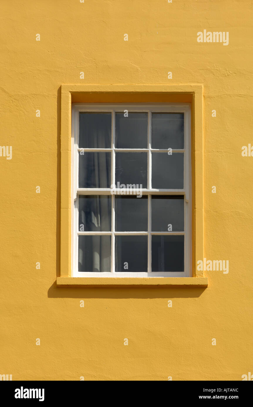 ABstract of a window on yellow painted wall Oxford England Stock Photo