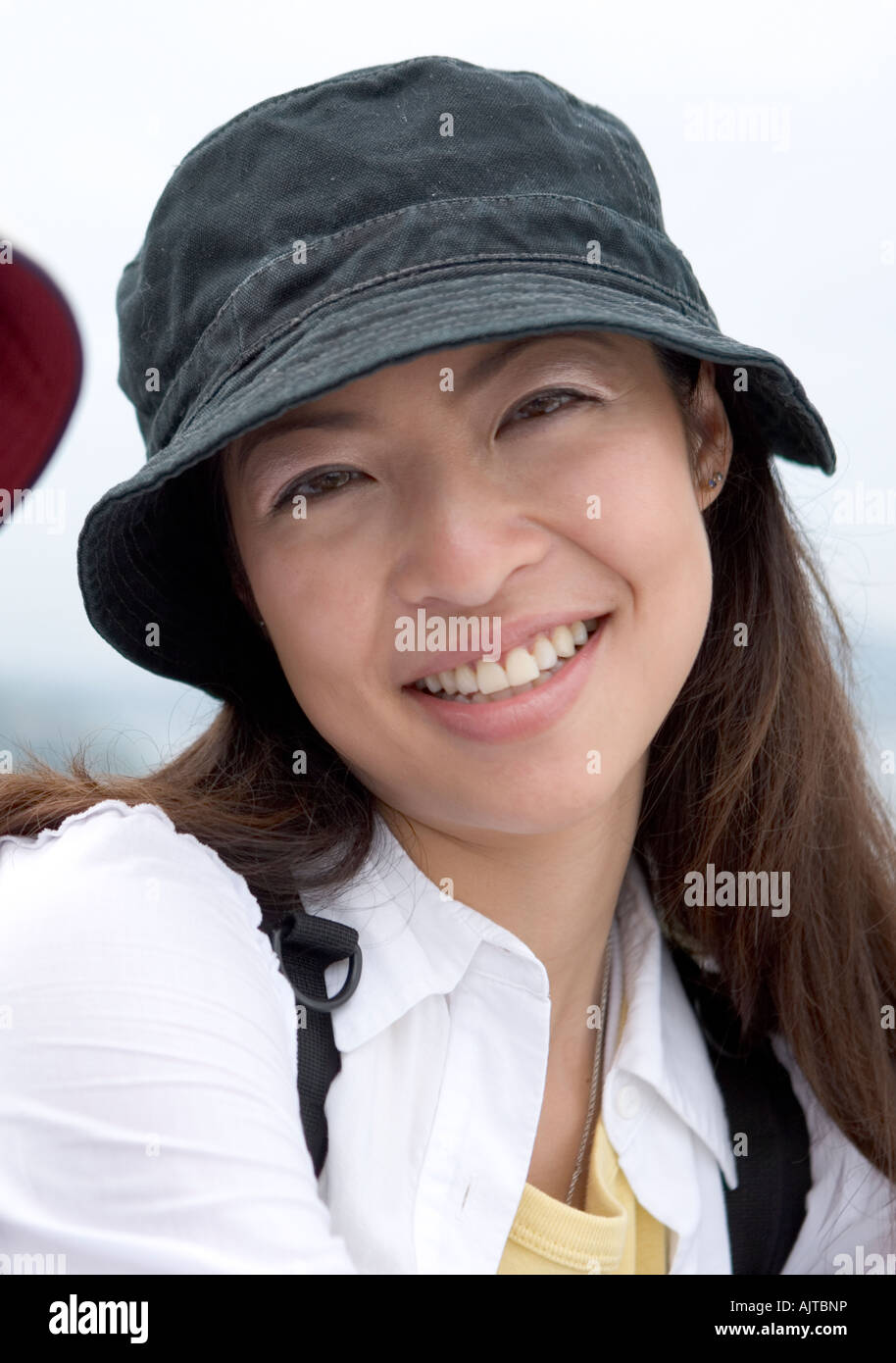 Portrait of a young woman smiling Stock Photo - Alamy