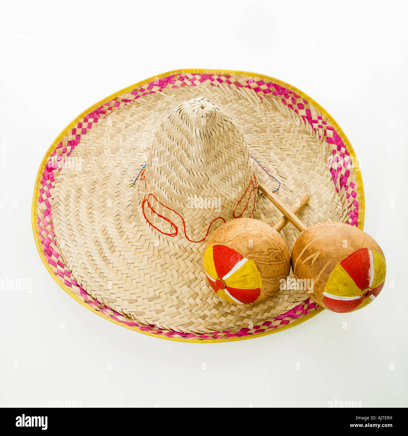 Pair of handmade Mexican maracas percussion musical instruments on sombrero  straw hat Stock Photo - Alamy