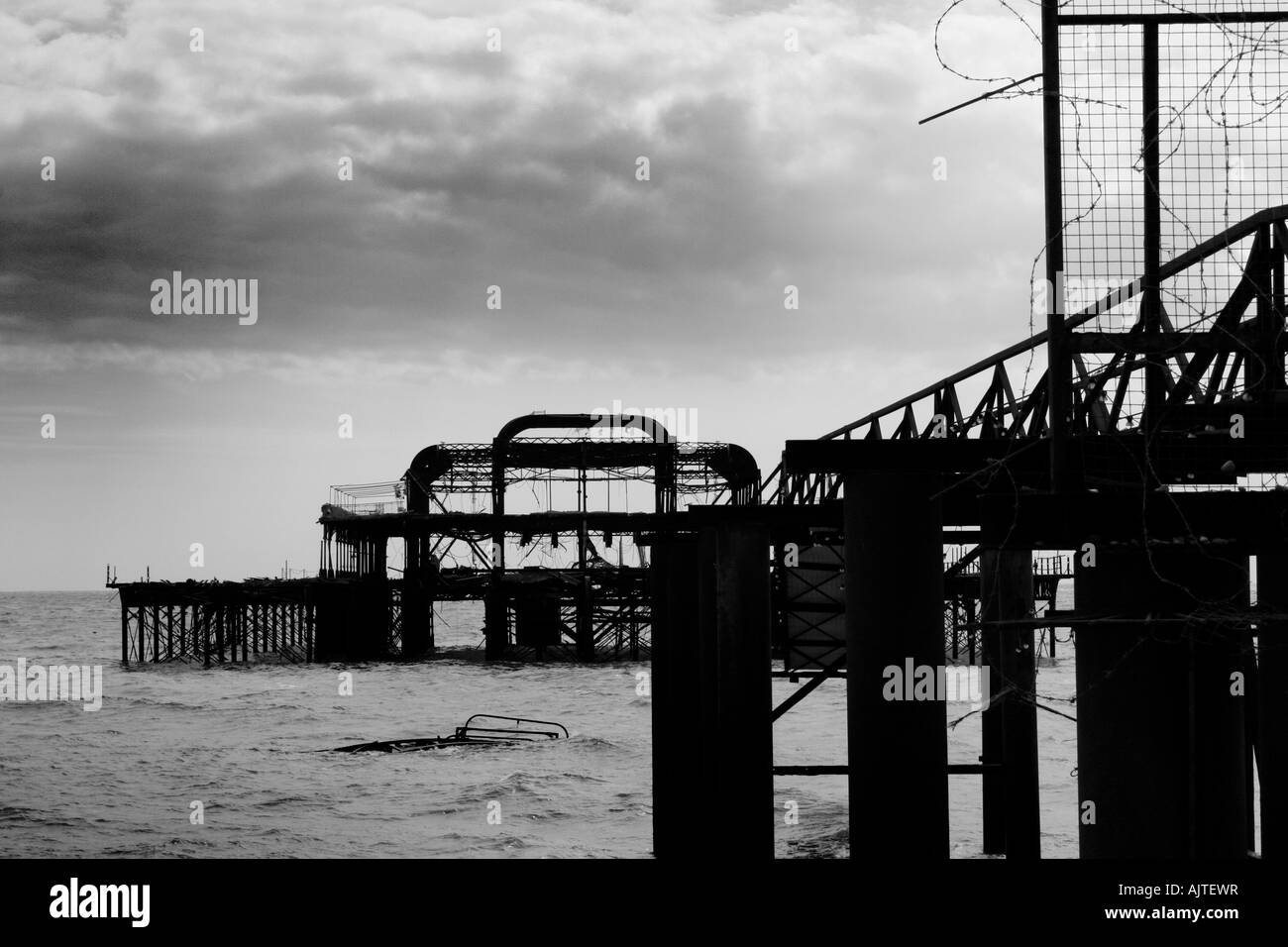 Black and white image of the remains of Brighton West Pier after fire, England, UK Stock Photo