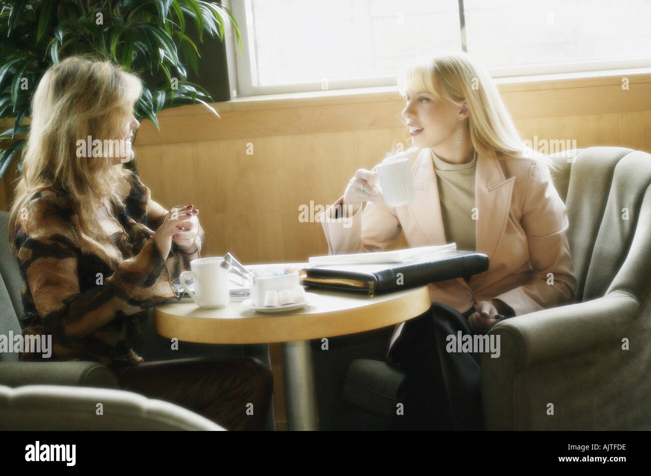 Two Women Having Coffee Stock Photo Alamy