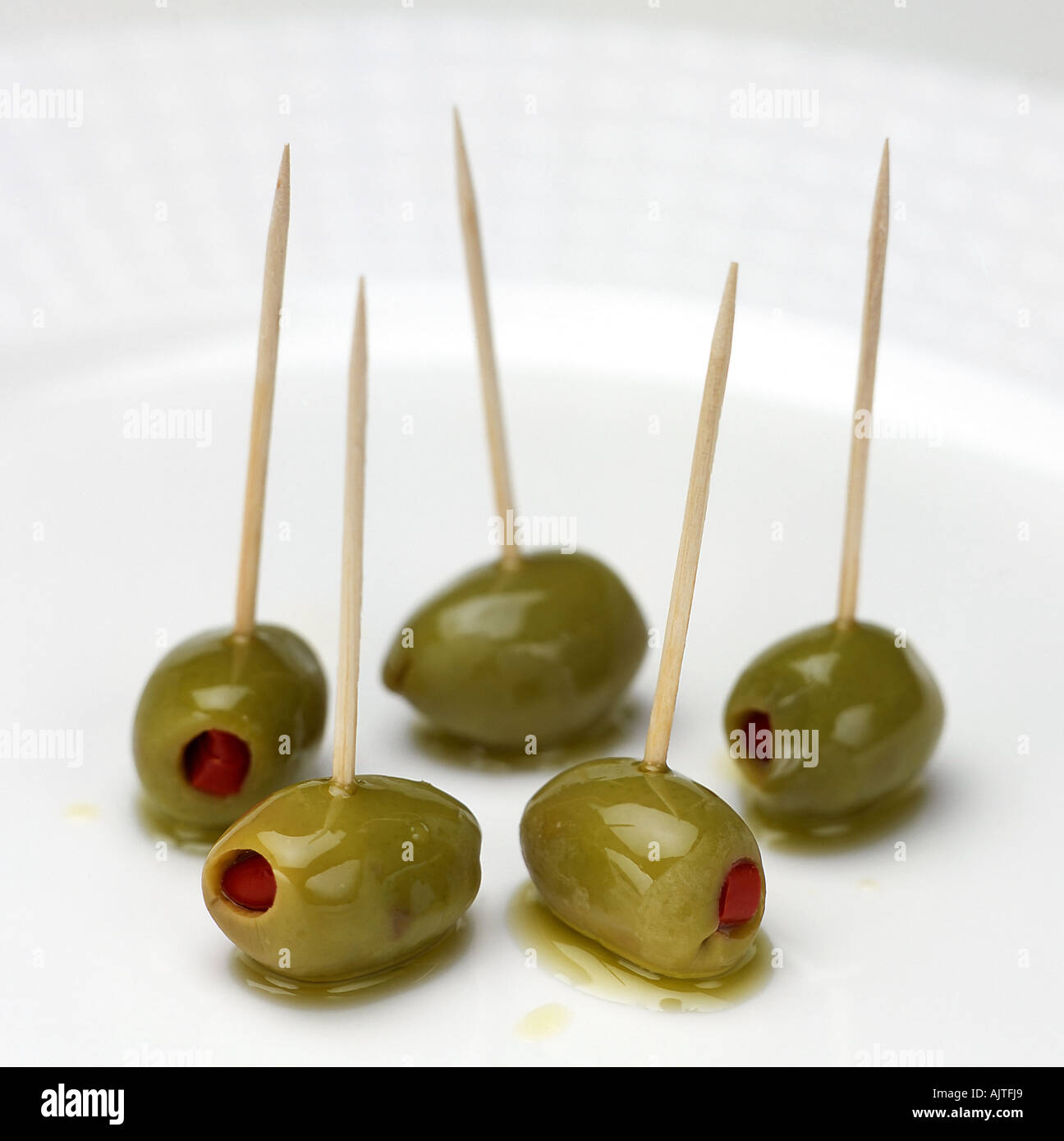 Olives on cocktail sticks Stock Photo Alamy