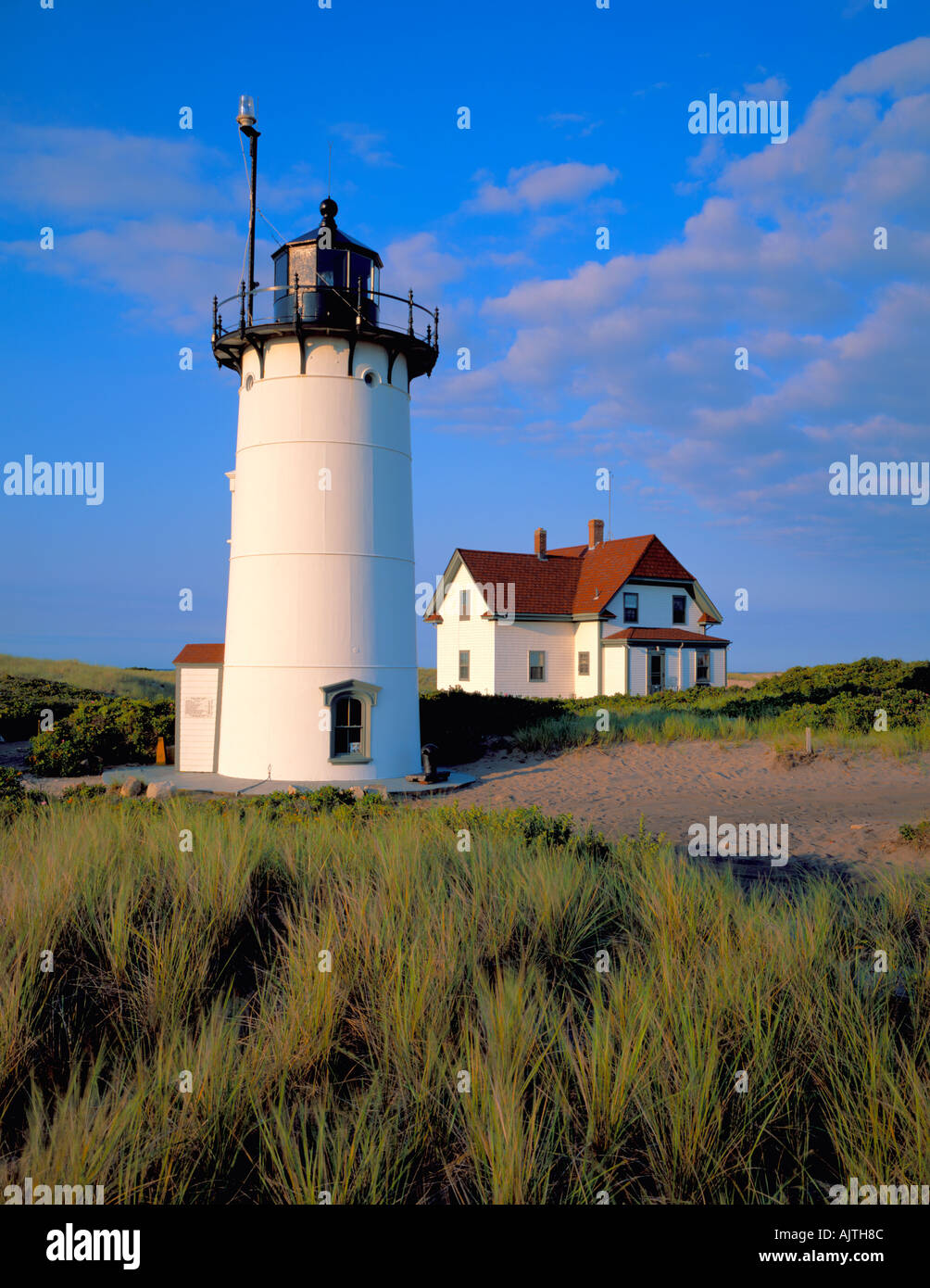 Cape Cod National Seashore MA Early morning clouds over Race Point Lighthouse 1876 at Race Point Stock Photo