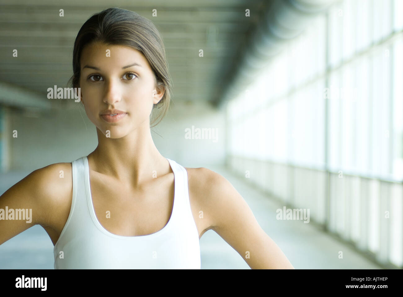 Teenage girl looking at camera, wearing tank top, portrait Stock Photo