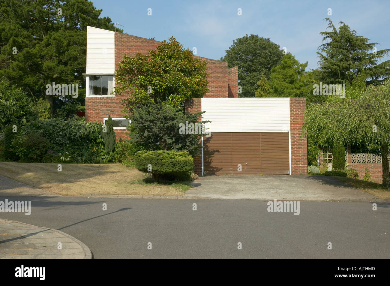 Housing, KingstonUponThames, Surrey. Half brick half timber clad house with garage Stock Photo