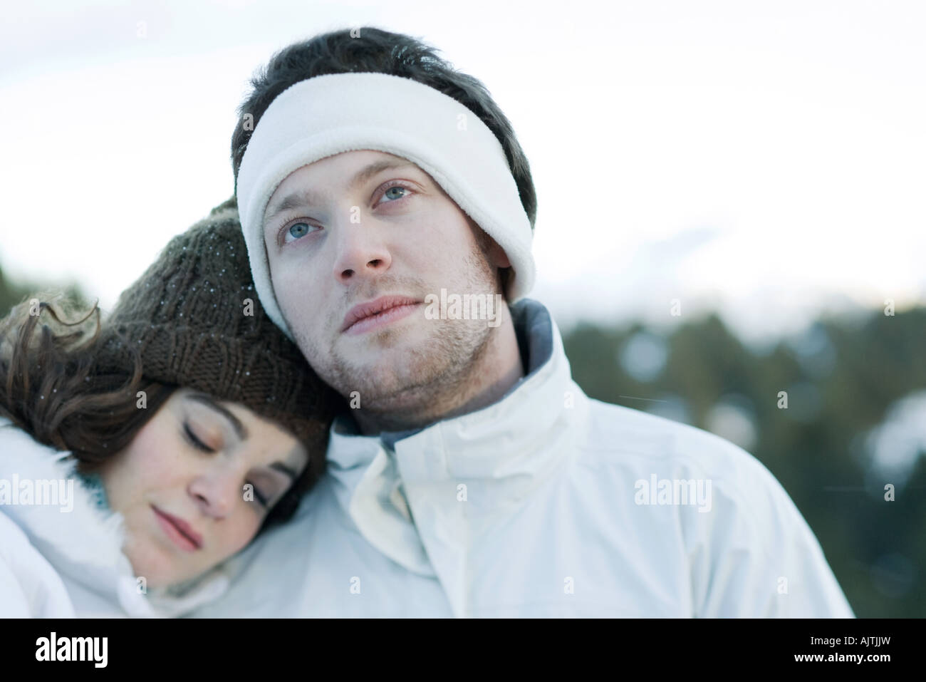 Young couple in snowy landscape, portrait Stock Photo - Alamy