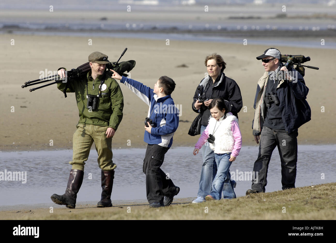 Bird watching on scottish island ISLAY  man and children with binoculars Stock Photo