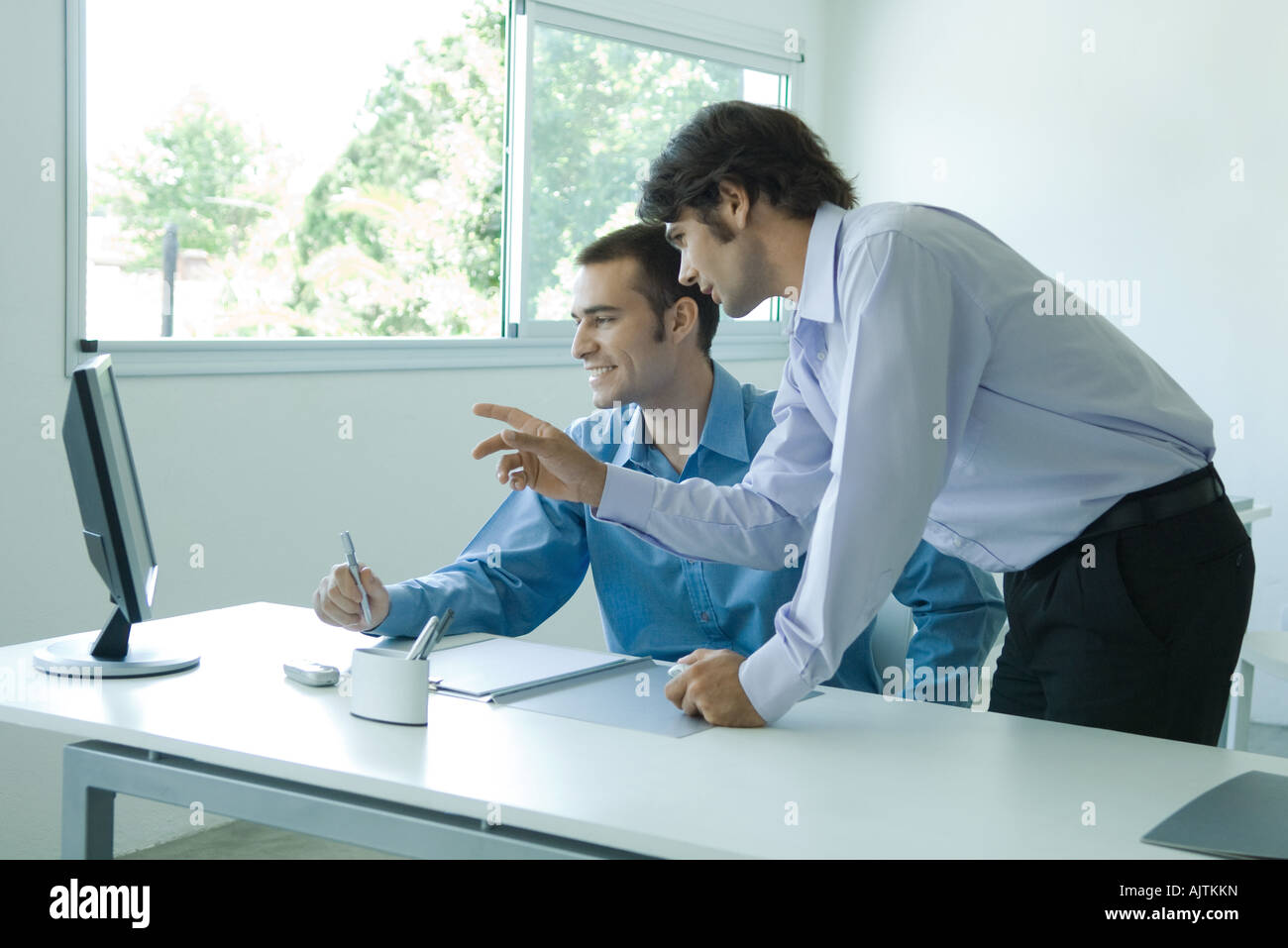 Businessman sitting desk facing monitor hi-res stock photography and ...