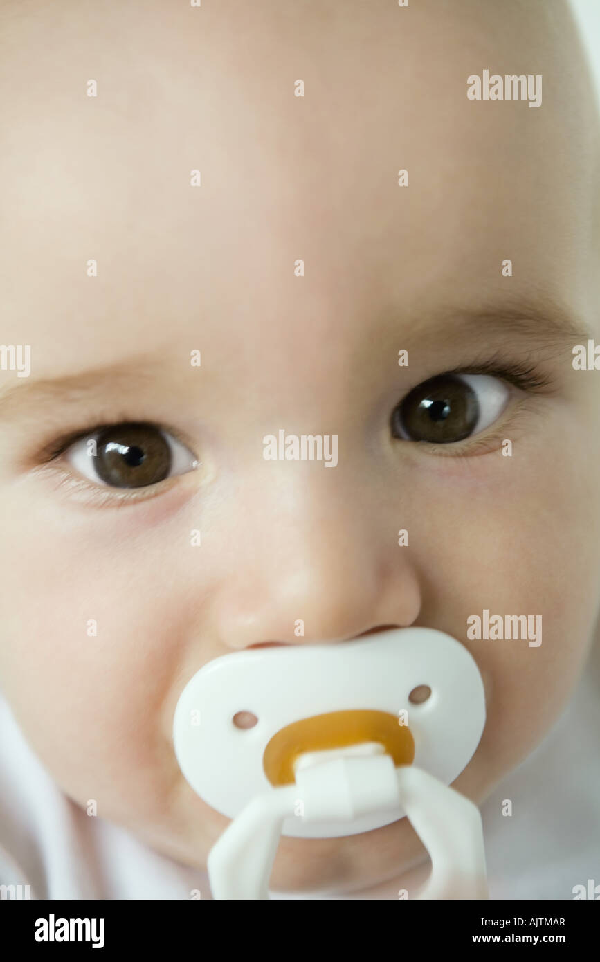 Baby with pacifier in mouth, closeup Stock Photo Alamy